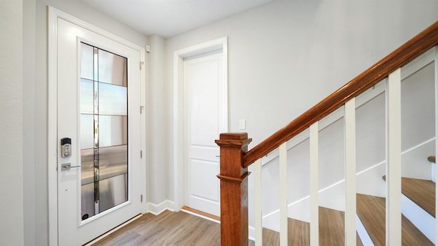 doorway with light hardwood / wood-style floors