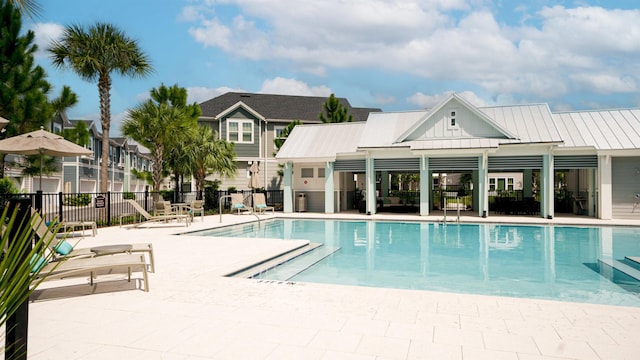 view of swimming pool with a patio area