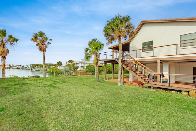 view of yard featuring a deck with water view