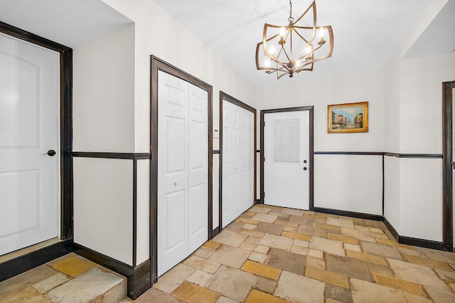 foyer with a notable chandelier