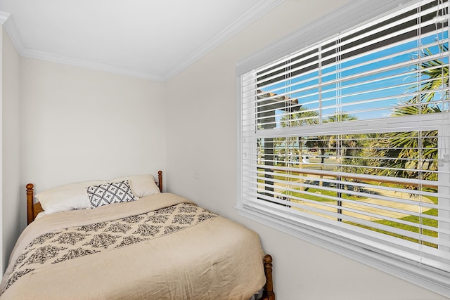 bedroom with ornamental molding