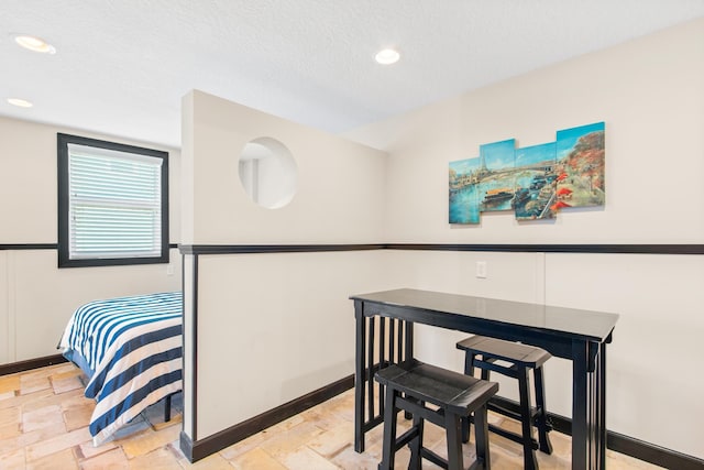 dining area with a textured ceiling