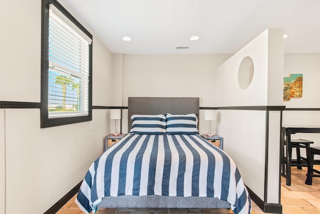 bedroom featuring a textured ceiling