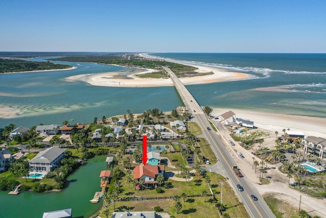 bird's eye view with a water view and a beach view