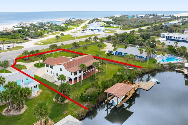 birds eye view of property featuring a water view