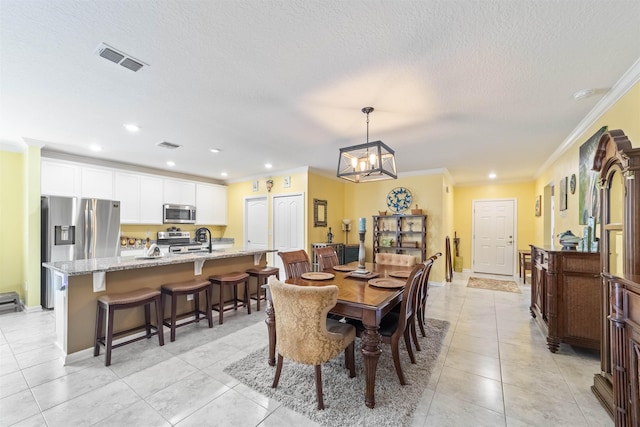 265 Aventurine Ave, Saint Augustine, FL 32086 - dining area with crown molding, light tile patterned flooring, a chandelier, a textured ceiling, and recessed lighting