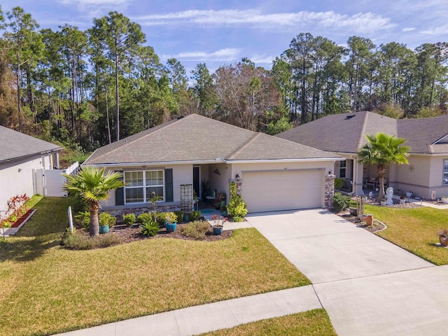 265 Aventurine Ave, Saint Augustine, FL 32086 - ranch-style home featuring a garage, concrete driveway, stucco siding, a front lawn, and stone siding