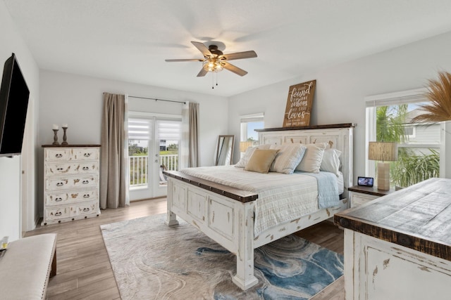 57 Guanahani Trl, Saint Augustine, FL 32080 - bedroom featuring access to exterior, multiple windows, light wood-style floors, and ceiling fan
