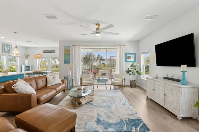 57 Guanahani Trl, Saint Augustine, FL 32080 - living room featuring light wood-style flooring, healthy amount of natural light, and a ceiling fan