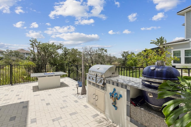 57 Guanahani Trl, Saint Augustine, FL 32080 - view of patio / terrace featuring exterior kitchen