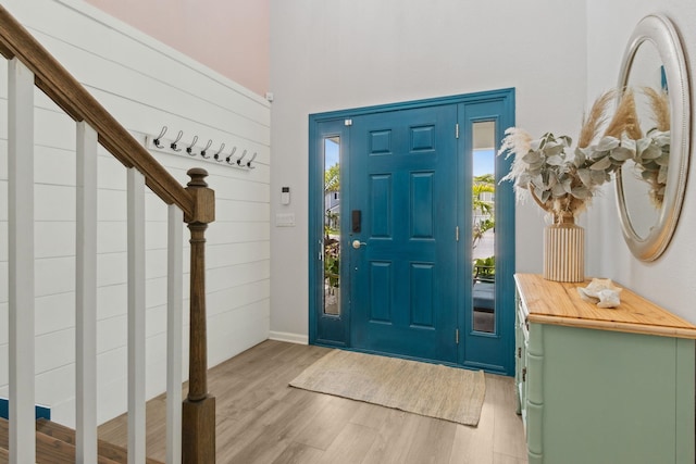 57 Guanahani Trl, Saint Augustine, FL 32080 - entryway featuring light wood-style floors, stairs, and a towering ceiling