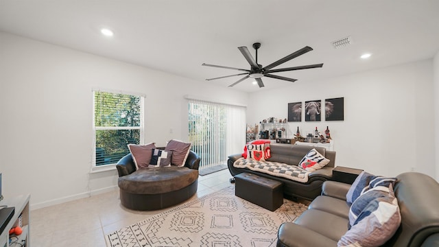 living room featuring ceiling fan and light tile patterned floors