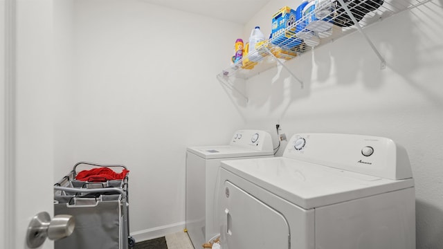 clothes washing area featuring washing machine and dryer