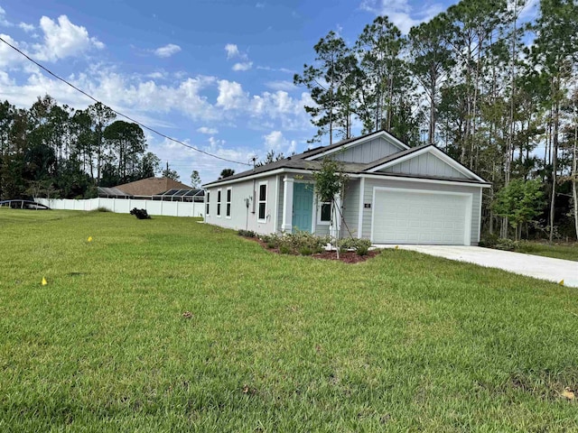 view of front of house featuring a garage and a front yard