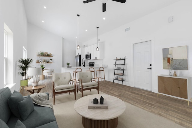 441 S Woodlawn St, Saint Augustine, FL 32084 - living area featuring high vaulted ceiling, a ceiling fan, wood finished floors, and recessed lighting