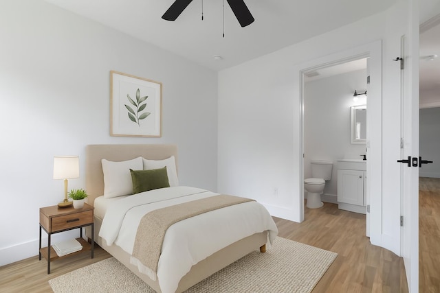 441 S Woodlawn St, Saint Augustine, FL 32084 - bedroom with light wood finished floors, ensuite bathroom, and a ceiling fan