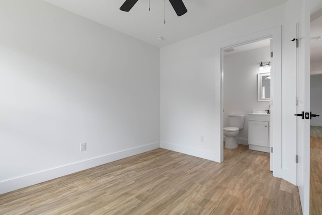 441 S Woodlawn St, Saint Augustine, FL 32084 - unfurnished bedroom featuring light wood finished floors, connected bathroom, and ceiling fan
