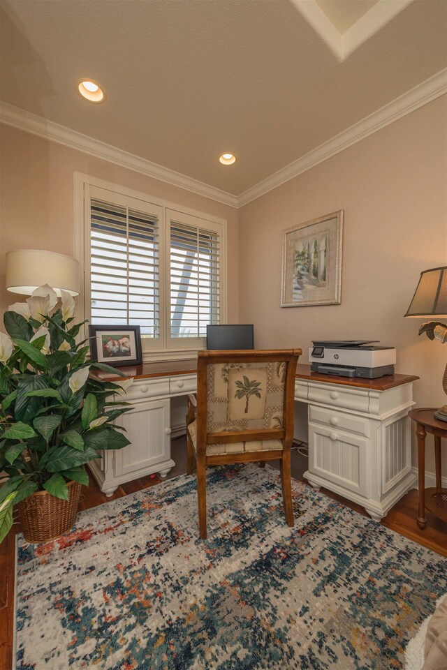 office area featuring hardwood / wood-style flooring and crown molding