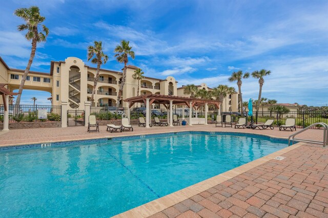 view of swimming pool with a pergola and a patio