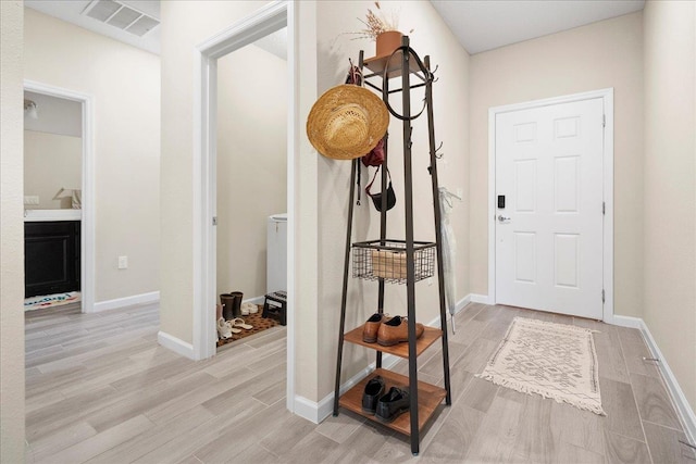 34 Anguilla Blvd, Saint Augustine, FL 32092 - foyer entrance with light wood-style floors and baseboards