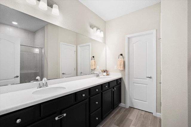 34 Anguilla Blvd, Saint Augustine, FL 32092 - full bath with double vanity, tiled shower, and wood finished floors