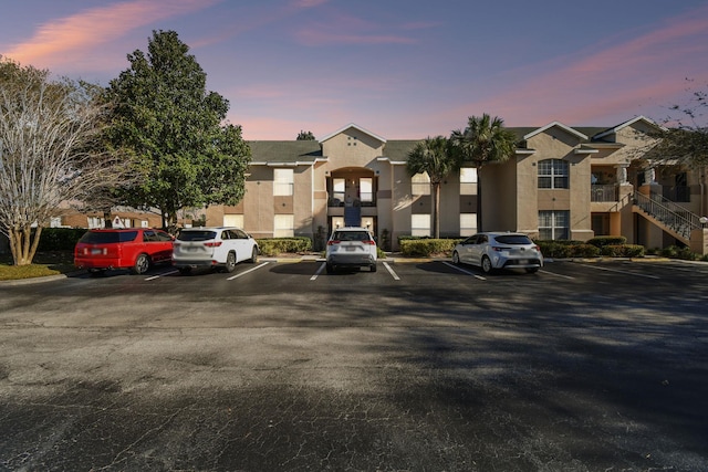 view of property with uncovered parking