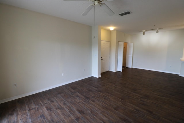 unfurnished room featuring ceiling fan, dark hardwood / wood-style floors, and track lighting