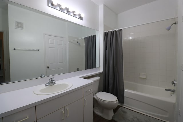 full bathroom featuring vanity, shower / bath combination with curtain, and toilet