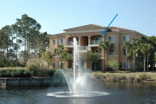 view of building exterior with a water view