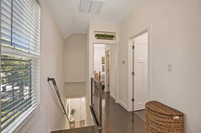 corridor featuring visible vents and an upstairs landing