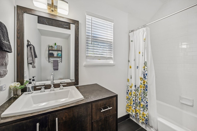 bathroom featuring vanity and shower / tub combo with curtain