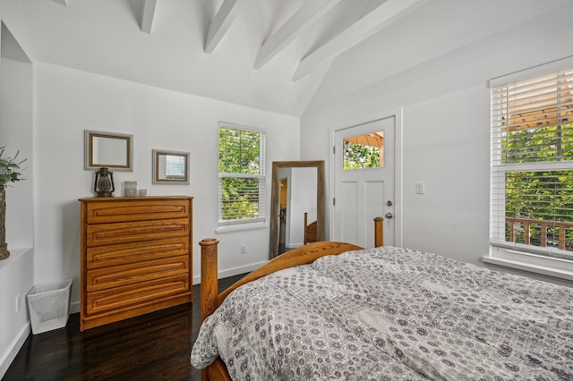 bedroom featuring dark wood-style floors, vaulted ceiling with beams, and baseboards