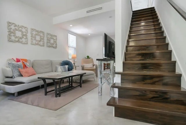 stairs featuring concrete floors