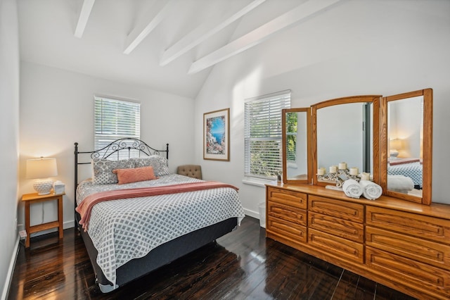 bedroom with multiple windows, dark wood-type flooring, and lofted ceiling with beams