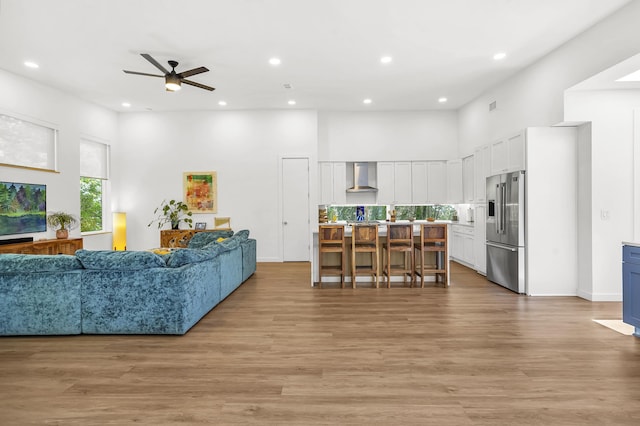 2470 Oleander St, Saint Augustine, FL 32080 - living room featuring ceiling fan, recessed lighting, a high ceiling, and light wood-type flooring