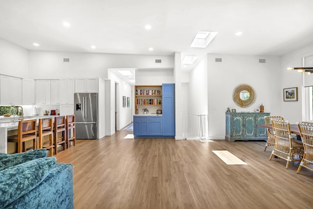 2470 Oleander St, Saint Augustine, FL 32080 - living area featuring bar area, light wood-style floors, and recessed lighting