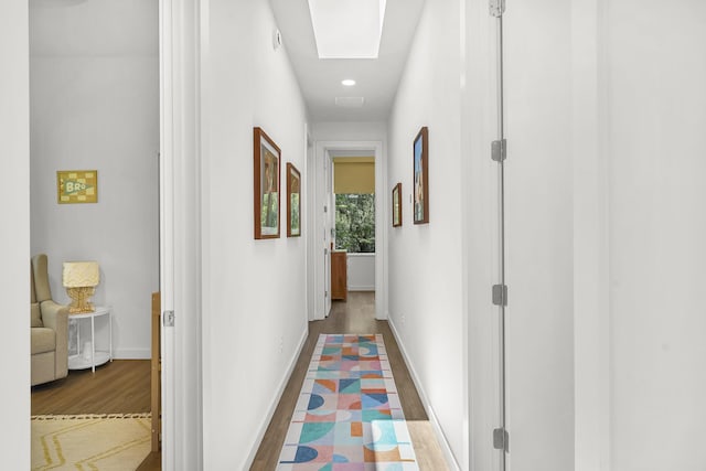 2470 Oleander St, Saint Augustine, FL 32080 - hallway with wood finished floors, a skylight, and recessed lighting