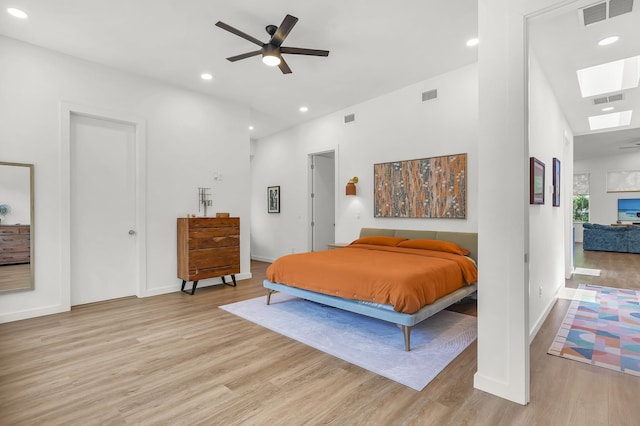 2470 Oleander St, Saint Augustine, FL 32080 - bedroom featuring a skylight, light wood finished floors, recessed lighting, and a ceiling fan