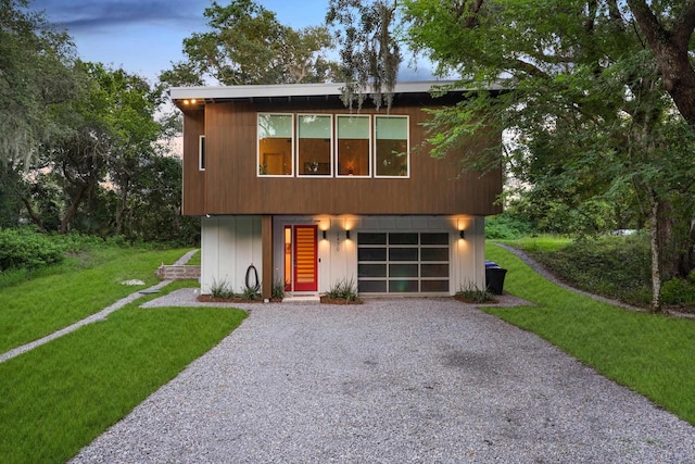 2470 Oleander St, Saint Augustine, FL 32080 - view of front facade featuring driveway, an attached garage, and a front yard