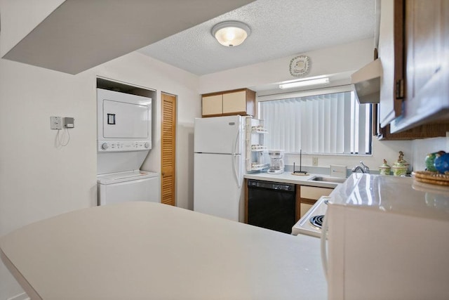 kitchen featuring a textured ceiling, sink, stacked washer / dryer, dishwasher, and white fridge