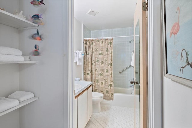 full bathroom with tile patterned flooring, shower / bath combo, vanity, and toilet