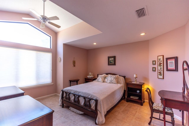 bedroom with ceiling fan, vaulted ceiling, and light tile patterned floors