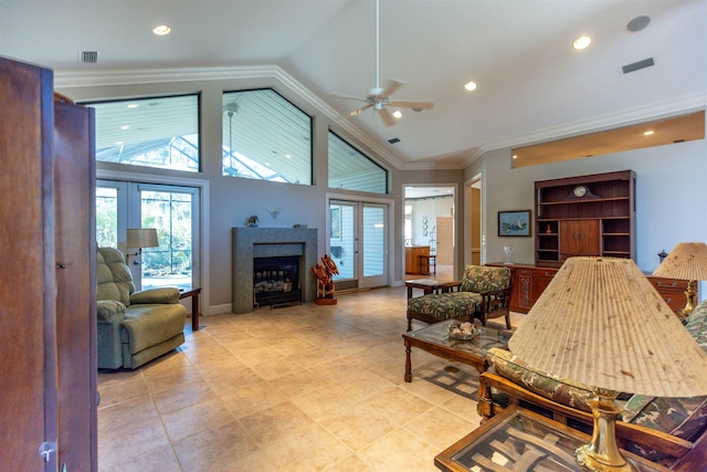 living room with crown molding, vaulted ceiling, and french doors