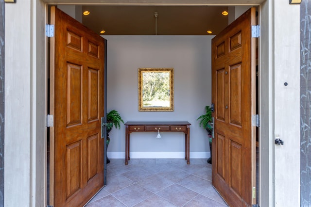 foyer featuring light tile patterned floors