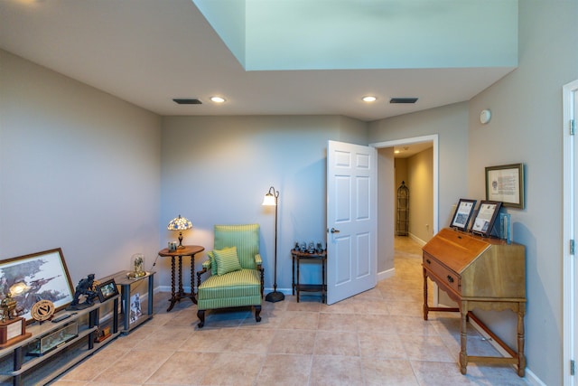 sitting room with light tile patterned floors