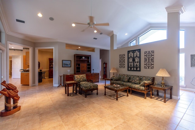 tiled living room featuring ceiling fan, high vaulted ceiling, ornamental molding, and decorative columns