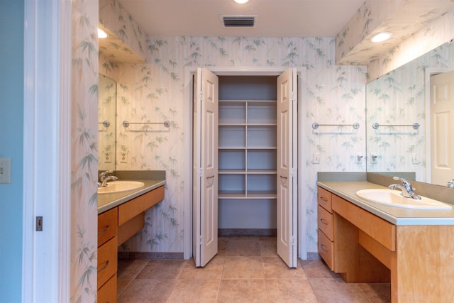 bathroom with vanity and tile patterned flooring