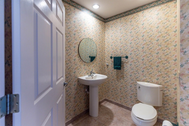 bathroom with tile patterned floors and toilet