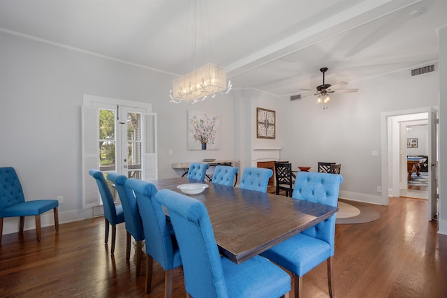 dining area with ceiling fan with notable chandelier, beam ceiling, dark hardwood / wood-style flooring, and crown molding