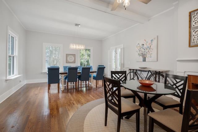 dining room featuring hardwood / wood-style floors, ceiling fan with notable chandelier, and crown molding